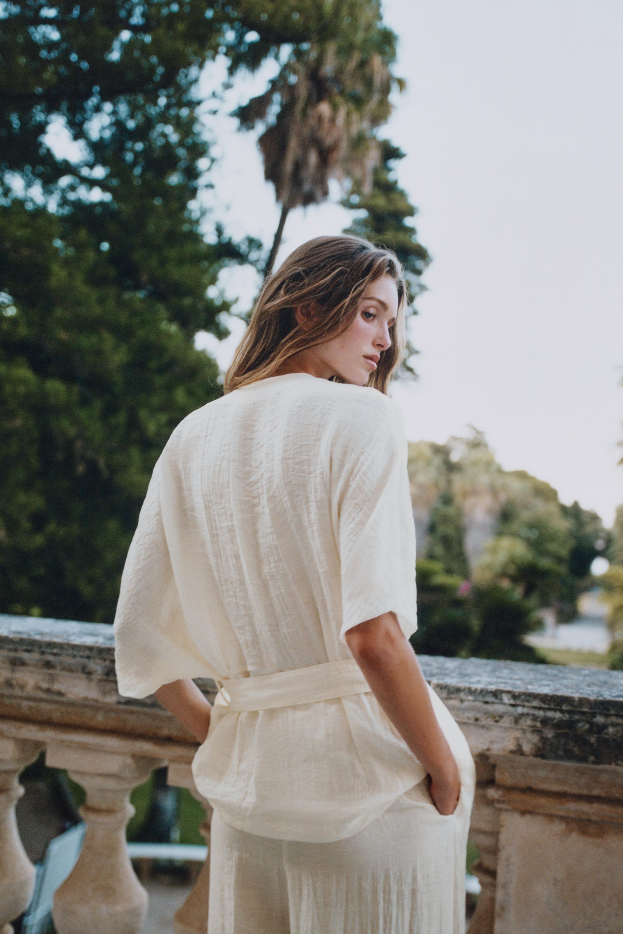 BELTED TOP WITH BUCKLE